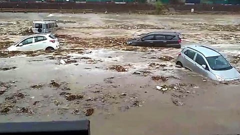 Vehicles washed away in the River Ganga after heavy rainfall, in Kotwali city area in Haridwar, Saturday, June 29, 2024.