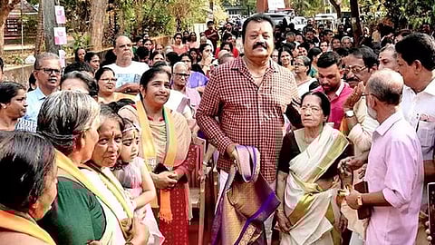 Actor-politician Suresh Gopi flanked by fans and party workers