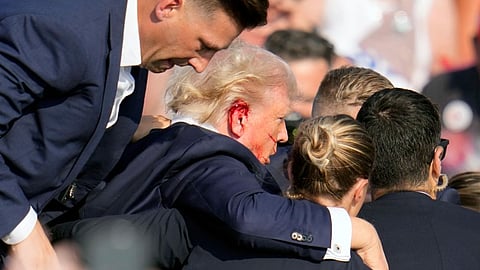 Injured Trump being taken away to safety from the spot.