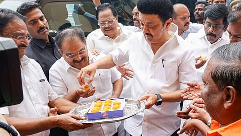 DMK Chief and Tamil Nadu Chief Minister MK Stalin distributes sweets to party workers as party candidate leads during counting of Vikravandi Assembly by-poll votes, in Chennai, Saturday, July 13, 2024.
