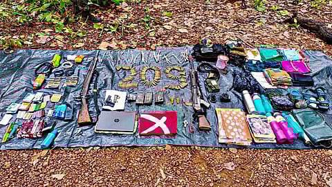Arms, ammunition and other things, recovered from a bunker of alleged CPI (Maoist) cadred by the security forces, being displayed at Saranda forest areas of Chaibasa, in West Singhbhum district of Jharkhand, Wednesday, July 17, 2024.