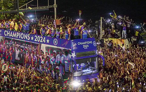 The T20 World Cup-winning Indian cricket team holding their victory parade with the championship trophy on top of a bus, in Mumbai, Thursday, July 4, 2024.