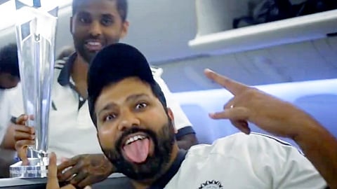 Indian cricket team captain Rohit Sharma with teammate Suryakumar Yadav aboard a charter flight to New Delhi. Indian cricket team on Thursday returned home after winning the ICC Men's T20 World Cup 2024 in Barbados.