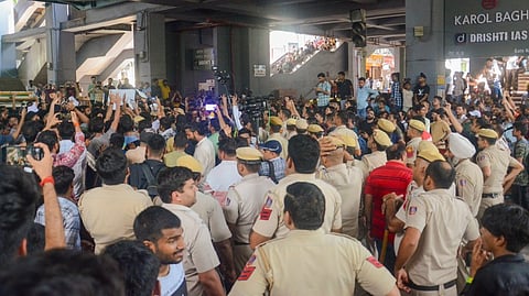 Students protest outside Karol Bagh metro station after 3 UPSC aspirants drown in the flooded basement of Rau's IAS institute at Old Rajinder Nagar area, in New Delhi, Sunday, July 28, 2024.