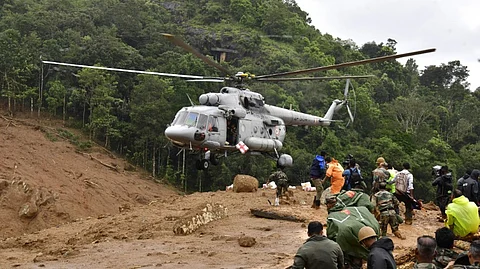 A chopper joins search and rescue operations following landslides in Mundakai, Chooralmala area, Wayanad district, Kerala