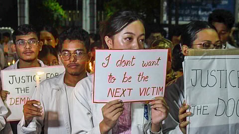 Resident doctors and students of Gauhati Medical College and Hospital take part in a soliditary march for the rape victim of Kolkata's R.G. Kar Medical College and Hospital, in Guwahati, Tuesday, Aug. 13, 2024.