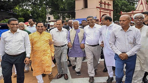 Bangladesh Chief Adviser Muhammad Yunus (C)