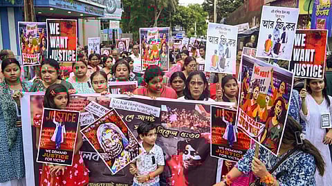 Artists and others take part in a protest against the alleged sexual assault and murder of a postgraduate trainee doctor in Kolkata, at Balurghat in Dakshin Dinajpur district, Monday, Aug. 19, 2024.