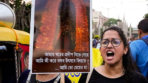 Doctors display placards during a protest dharna over the RG Kar Hospital rape and murder incident, in Kolkata, Wednesday, Sept. 11, 2024.