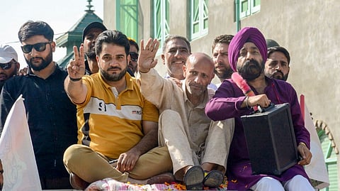 MP and Awami Ittehad Party chief Sheikh Abdul Rashid with party candidate from Tral constituency Harbaksh Singh during a roadshow ahead of J&K Assembly elections, at Tral area in Pulwama district, Jammu & Kashmir, Sunday, Sept. 15, 2024.