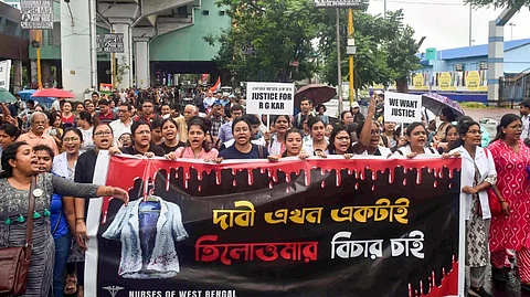 Medics take part in a protest march to Swasthya Bhavan over the alleged sexual assault and murder of a trainee doctor, in Kolkata, Sunday, Sept. 15, 2024.