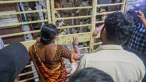 Parents of Akshay Shinde, the accused in the Badlapur sexual assault case of two minor girls, outside the Kalwa Hospital where his body was brought after the police encounter, in Thane, late Monday night, Sept. 23, 2024.