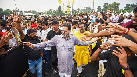 Jan Suraaj founder Prashant Kishor greets supporters during the formal launch of his new political party as Jan Suraaj Party at Veterinary College grounds, in Patna, Wednesday, Oct. 2,2024.