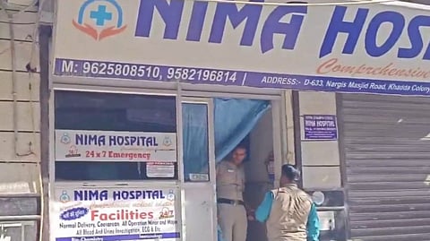 A police official and others during an investigation at Nima Hospital where a doctor was allegedly shot dead, in New Delhi, Thursday, Oct. 3, 2024.