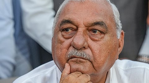 Former Haryana chief minister and Congress leader Bhupinder Singh Hooda reacts to the media regarding the Haryana Assembly election results, in Rohtak, Tuesday, Oct. 8, 2024.