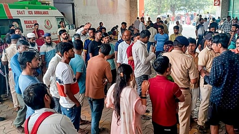 Police personnel, passengers and others at Bandra railway station after a stampede, in Mumbai, Sunday, Oct. 27, 2024.