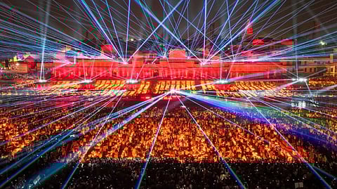 A top view of a laser show at a ghat on the banks of the Saryu River during 'Deepotsav 2024' on the eve of the 'Diwali' festival, in Ayodhya.