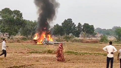 Smoke billows after an IAF plane crashed and caught fire, near Agra, Monday, Nov. 4, 2024. The pilot of the aircraft ejected safely.