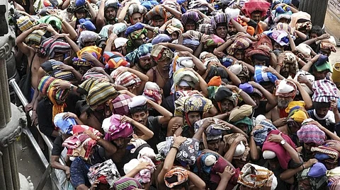 Devotees arrive to offer prayers at the Sabarimala temple, in Pathanamthitta district, Kerala