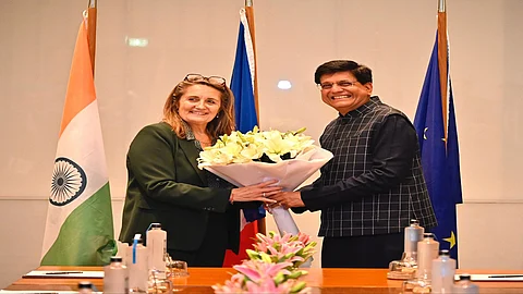 French foreign trade minister Sophie Primas is being greeted by Commerce Minister Piyush Goyal