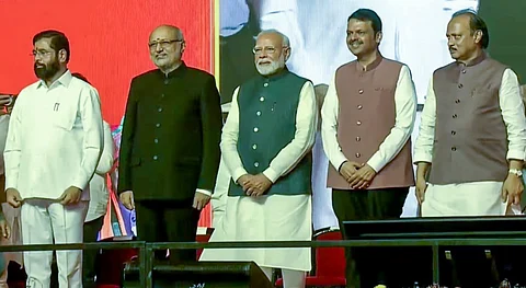 Prime Minister Narendra Modi and Maharashtra Governor CP Radhakrishnan with the newly-sworn Maharashtra Chief Minister Devendra Fadnavis and Deputy Chief Ministers Eknath Shinde and Ajit Pawar during the swearing-in ceremony, in Mumbai, Thursday, Dec. 5, 2024.