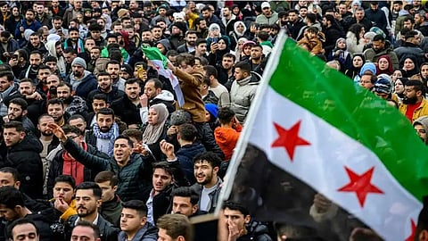 Syrial people celebrate Assad's fal