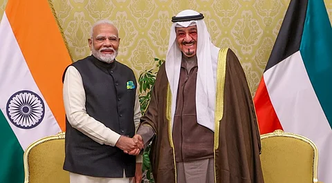Prime Minister Narendra Modi with his Kuwaiti counterpart Sheikh Ahmed Abdullah Al-Ahmad Al-Sabah during the signing of an MoU at a meeting, in Kuwait, Sunday, Dec. 22, 2024.
