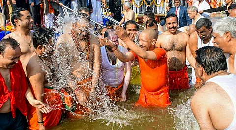 Uttar Pradesh Chief Minister Yogi Adityanath with his Cabinet colleagues takes a holy dip at the Sangam during the Maha Kumbh Mela 2025, in Prayagraj, Uttar Pradesh, Wednesday, Jan. 22, 2025.