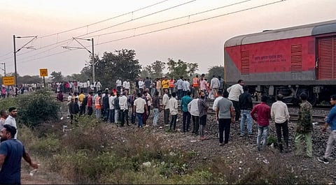 People gather after a train mishap, in Jalgaon district, Maharashtra, Wednesday, Jan. 22, 2025.