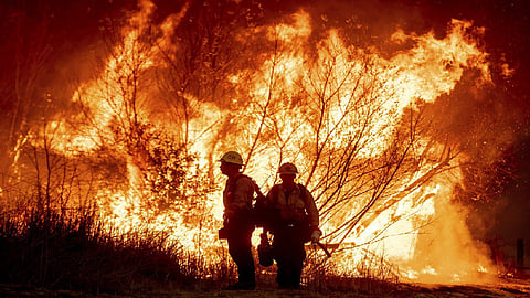 Firefighters battle to maintain the upper hand on a huge fire north of Los Angeles