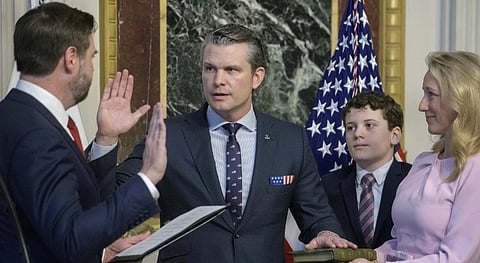Vice President JD Vance, from left, swears in Pete Hegseth to be Secretary of Defense as his wife Jennifer Rauchet holds the Bible and Hegseth's son watches in the Indian Treaty Room of the Eisenhower Executive Office Building on the White House campus in Washington, Saturday, Jan. 25, 2025.