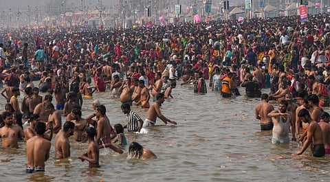 Devotees take a holy dip at the Sangam during the Maha Kumbh Mela 2025, in Prayagraj, Uttar Pradesh