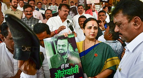 Members of the ruling Mahayuti stage a protest against Samajwadi Party MLA Abu Asim Azmi