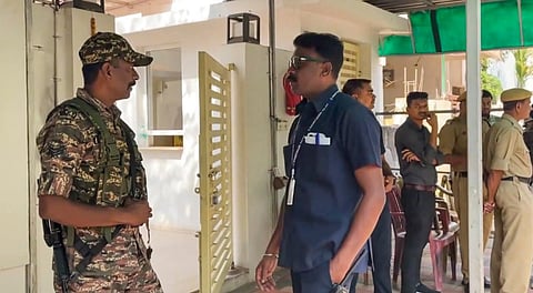 Security personnel stand guard during raids by the Enforcement Directorate (ED) on premises linked to Chaitanya Baghel, son of former Chhattisgarh Chief Minister and Congress leader Bhupesh Baghel, in connection with an alleged liquor scam, in Bhilai, Monday, March 10, 2025.