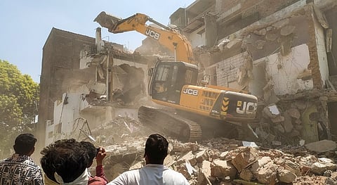 The house of Fahim Khan, alleged mastermind behind the Nagpur riots, being demolished, after he failed to remove an illegal structure within a 24-hour deadline, in Nagpur, Monday, March 24, 2025.