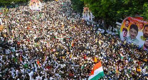 People gather near the statue of Dr BR Ambedkar to protest against the Waqf (Amendment) Act, in Hyderabad, Telangana, Sunday, April 13, 2025.