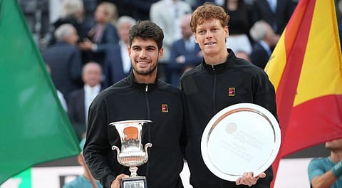Carlos Alcaraz of Spain, left, and Jannik Sinner of Italy pose for the photographers after their final tennis match in the Italian Open at the Foro Italico in Rome, Sunday, May 18, 2025.