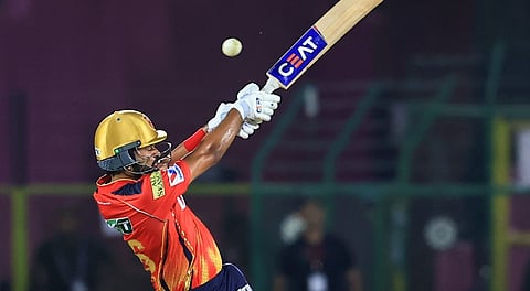 Shreyas Iyer plays a shot during an Indian Premier League (IPL) 2025 T20 cricket match between Punjab Kings and Delhi Capitals.