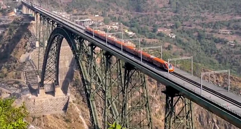 A newly-inaugurated Vande Bharat Express train crosses the Chenab Bridge, in Reasi district, Jammu and Kashmir, Saturday, June 7, 2025.