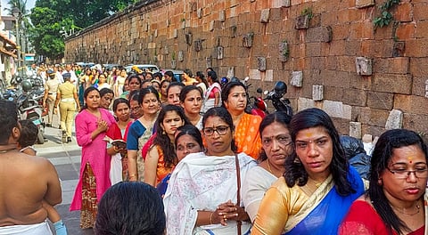 People arrive to offer prayers at Sree Padmanabhaswamy Temple, in Thiruvananthapuram, Kerala, Sunday, June 8, 2025.