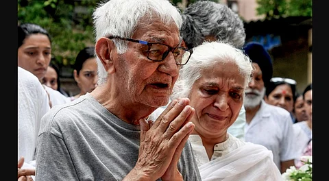 Pushkaraj Sabharwal, father of Captain Sumeet Sabharwal who was the pilot of the Air India plane which crashed in Ahmedabad last week, pays tribute after his son's mortal remains were brought to Mumbai for his last rites, Tuesday, June 17, 2025.