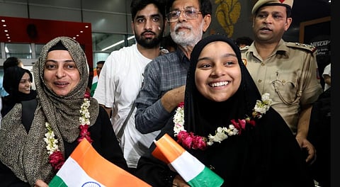 Indian nationals evacuated from Iran as part of the government's Operation Sindhu arrive at Delhi airport.