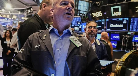 Traders work on the floor of the New York Stock Exchange.