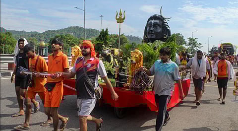 'Kanwariyas' arrive for Lord Shiva's worship on the first Monday of the holy month of 'Shravan', amid the ongoing 'Kawad Yatra', in Bhopal, Monday, July 14, 2025.