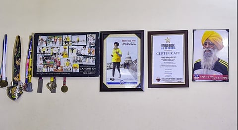 Medals and certificates won by veteran marathon runner Fauja Singh, who died after being hit by an unidentified vehicle while out for a walk in his native village, adorn the walls at his home in Jalandhar district, Tuesday, July 15, 2025.
