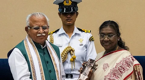 President Droupadi Murmu is being presented a sarangi, made using waste material, by Union Minister for Housing & Urban Affairs Manohar Lal during the Swachh Survekshan Awards ceremony, in New Delhi, Thursday, July 17, 2025.