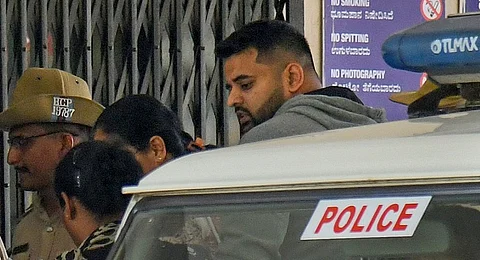 Police escort former MP and suspended JD(S) leader Prajwal Revanna after a special court sentenced him to life imprisonment in a rape case, in Bengaluru, Karnataka, Saturday, Aug. 2, 2025.
