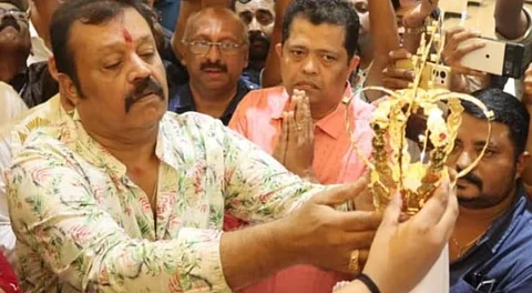 Suresh Gopi placing the crown on the statue of Mother Mary in Thrissur.