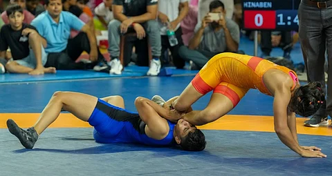 Wrestlers Antim Panghal, blue, and Hinaben compete in the 53 kg event during trials for the �World Wrestling Championships 2025' , at Indira Gandhi Arena, in New Delhi, Sunday, Aug. 3, 2025.