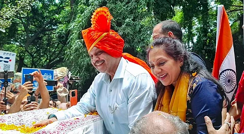 Lieutenant Colonel Prasad Purohit, one of the seven accused acquitted by a court in the 2008 Malegaon bomb blast case, being welcomed by his family members and supporters upon his return to his home, in Pune, Maharashtra, Sunday, Aug. 3, 2025.